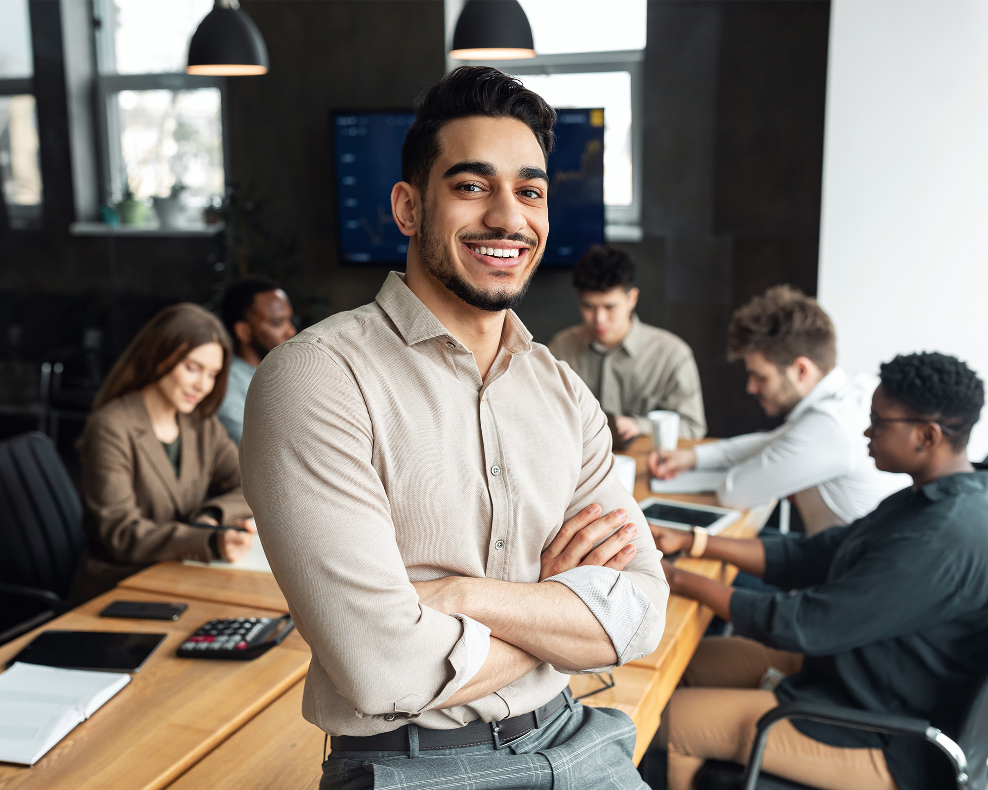 Man in a business context poses for a photo